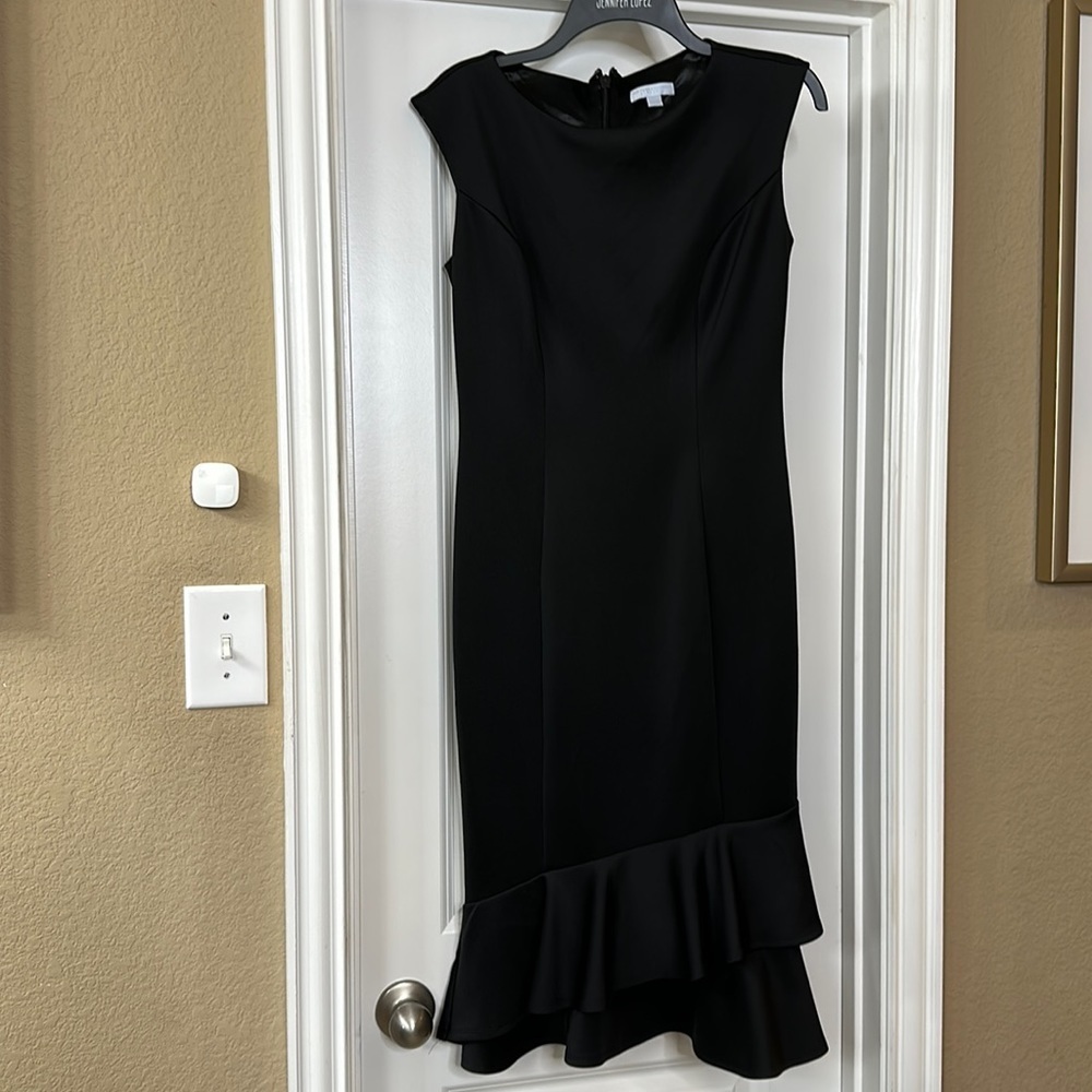 Little black dress size Small with a ruffled layer hem‎